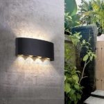 Exterior wall light on garden wall with warm decorative beam