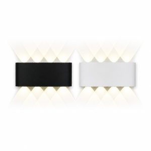 Black and white exterior wall light with warm criss-cross beam