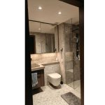 Round white down lights for ceiling installed in a Singapore condo bathroom