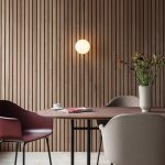 Round wall light dining area wood panel wall Singapore