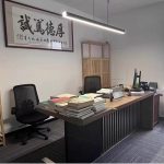 black hanging light installed above office desk in Singapore