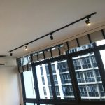 Black tracklight installed in Singapore condo living room