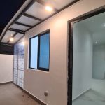 Bulkhead outdoor ceiling light installed at Singapore landed house walkway