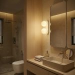 White Pearl wall with light beside bathroom vanity mirror