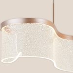 Close-up detail of Seraphina dining table light pendant with acrylic texture and champagne finish