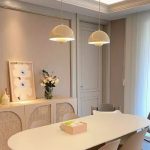 japandi pendant light in cream finish above dining table