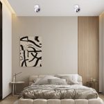 Rotatable LED ceiling spotlight installed in modern bedroom, surface-mounted adjustable spotlight for focused ambient lighting