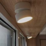 Surface mounted downlight rotatable tiltable LED ceiling light installed near window for directional lighting