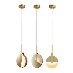 Solaris dining table pendant light, also kitchen pendant lighting in matt gold showing three design angle options