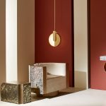 Solaris pendant light in matt gold used as a dining light for cozy corner styling