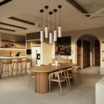 Wabi sabi pendant light in beige stone finish above modern wooden dining table