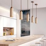Wabi sabi pendant light cluster above kitchen island with natural stone texture