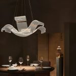 Hanging dining room lights LED pendant light above round dining table in ambient interior