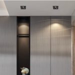 Black recessed spotlights installed on false ceiling above wardrobe with adjustable downlight eyeball beam