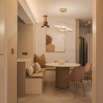 Acorn DC360 sand gold corner fan installed above a dining room corner