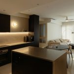 Eryx trimless downlight in warm modern kitchen and dining space with recessed ceiling lighting