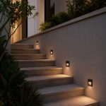 Black LED step lights on outdoor garden staircase wall at night